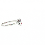 Lady's 14 Karat White Gold Ring featuring a Bezel-Set Pear-Shape Ruby and Diamond Accents